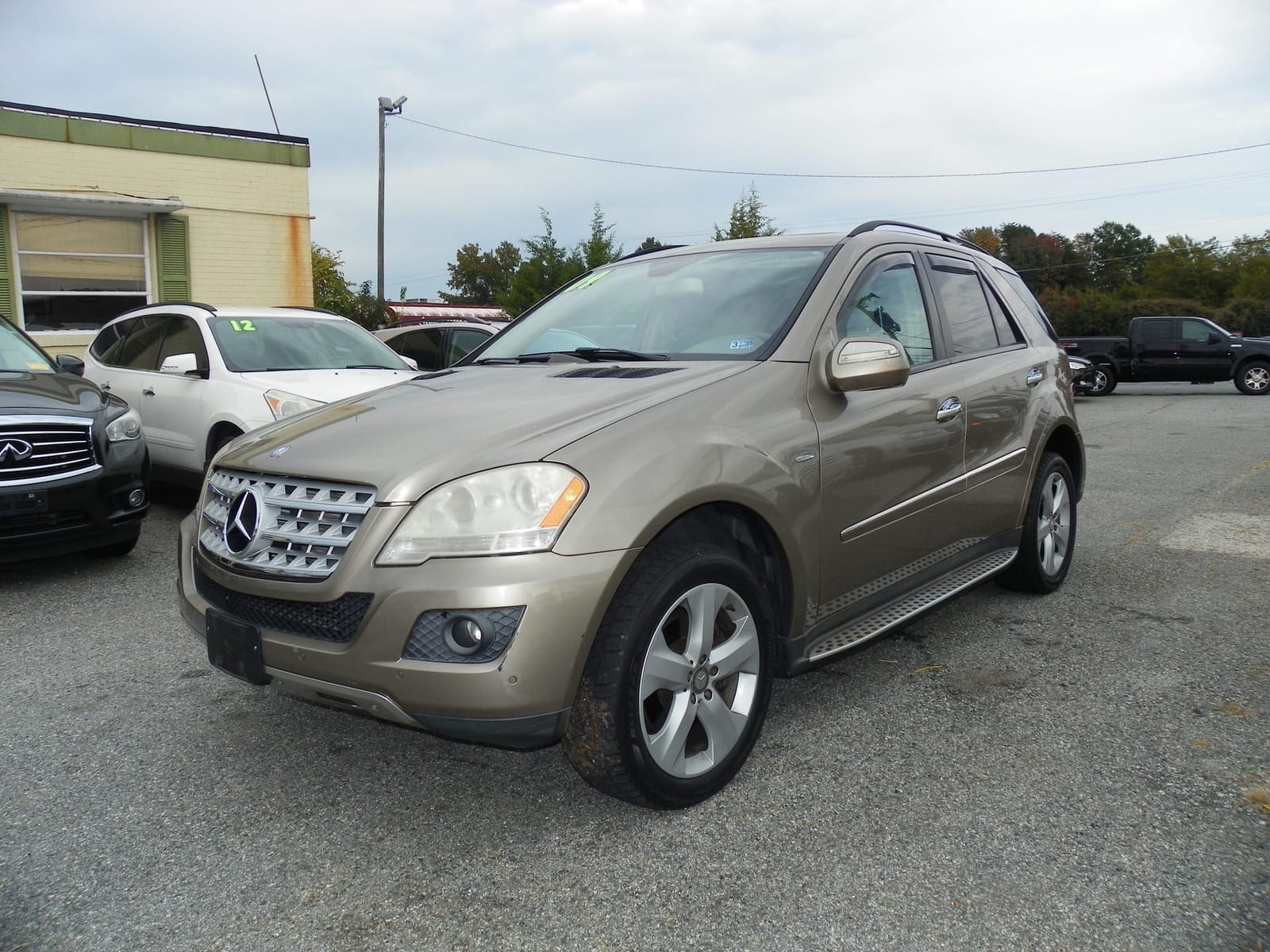 Gold 2009 Mercedes-Benz ML 320 on the Guilford Motors lot in Greensboro